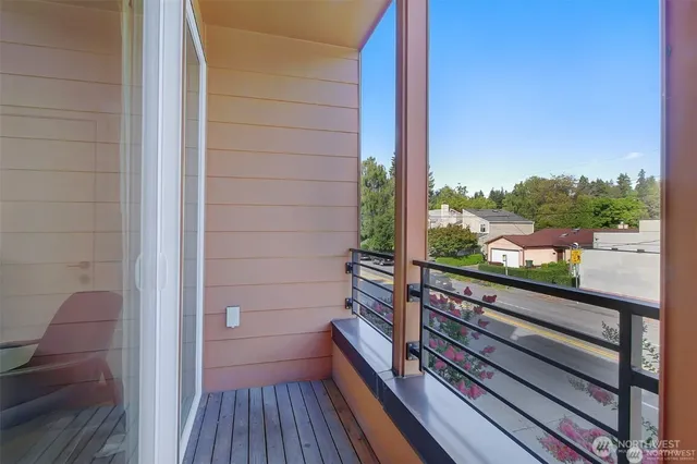 a view of a balcony with a potted plant