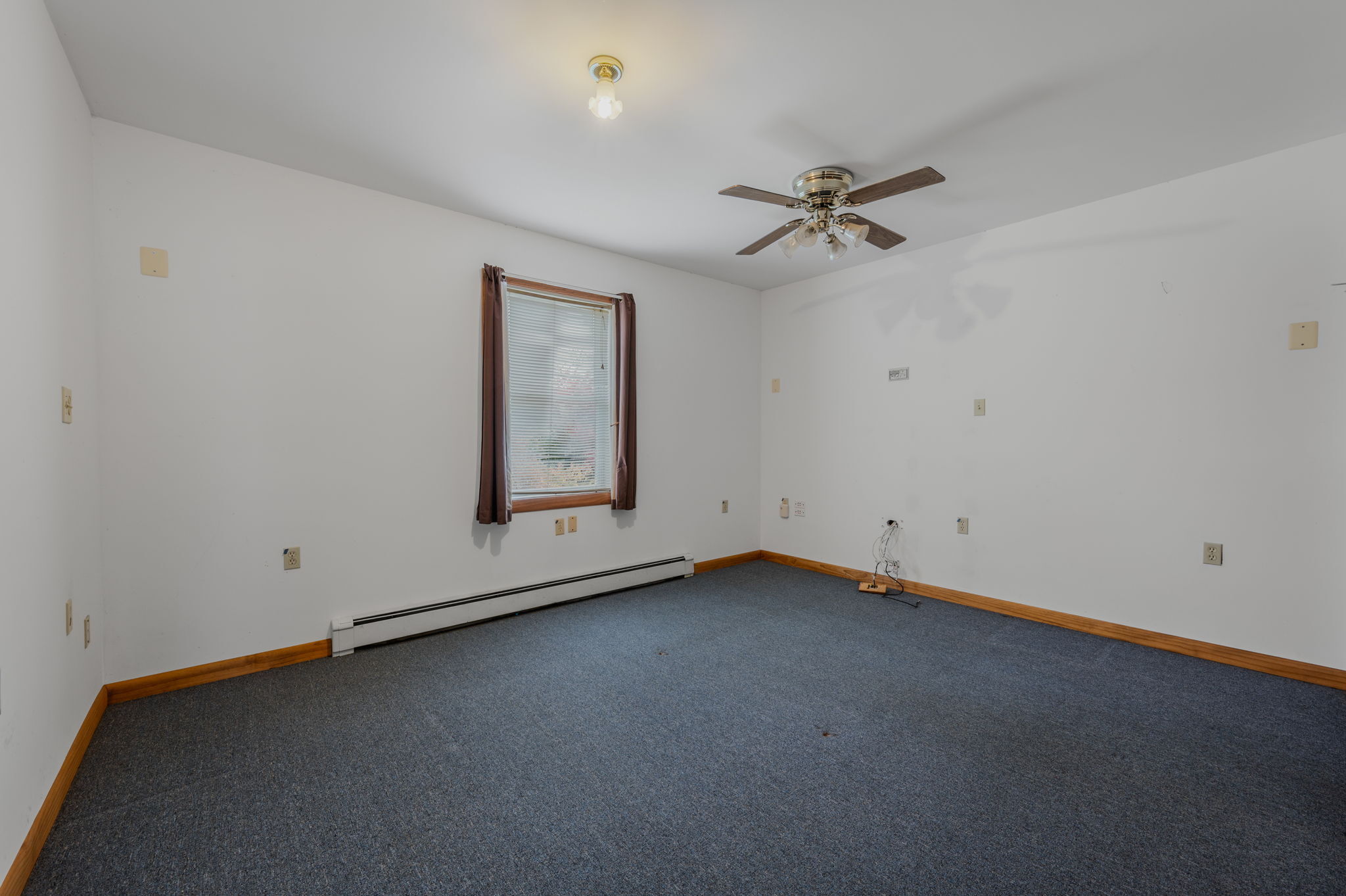 68 Clark Lane Waterford, CT 06385 - Photo 15 of 28 an empty room with a ceiling fan and a window