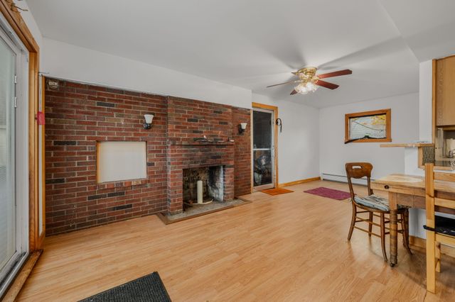a view of a livingroom with furniture and a kitchen