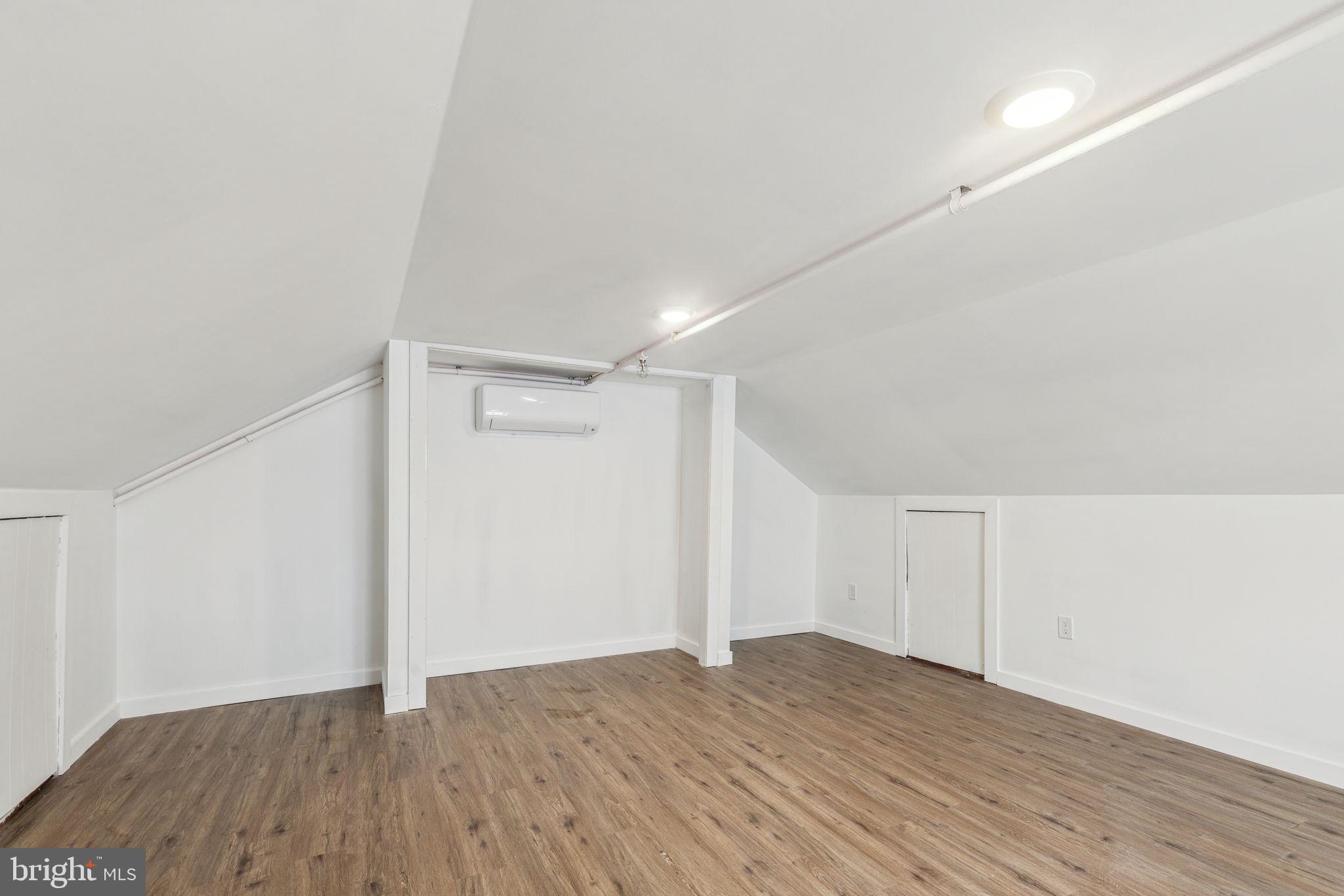 7041 Ridge Avenue Philadelphia, PA 19128 - Photo 11 of 22 a view of an empty room with wooden floor