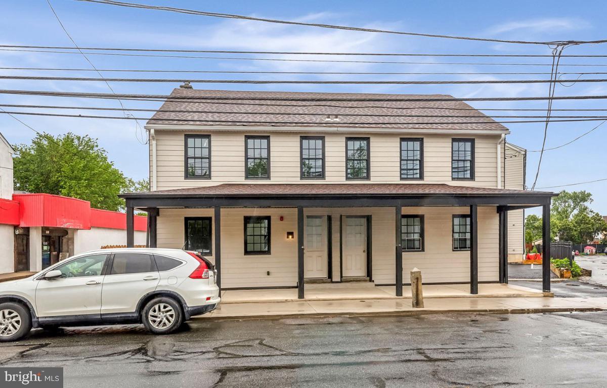 7041 Ridge Avenue Philadelphia, PA 19128 - Photo 2 of 22 a front view of a house with parking space