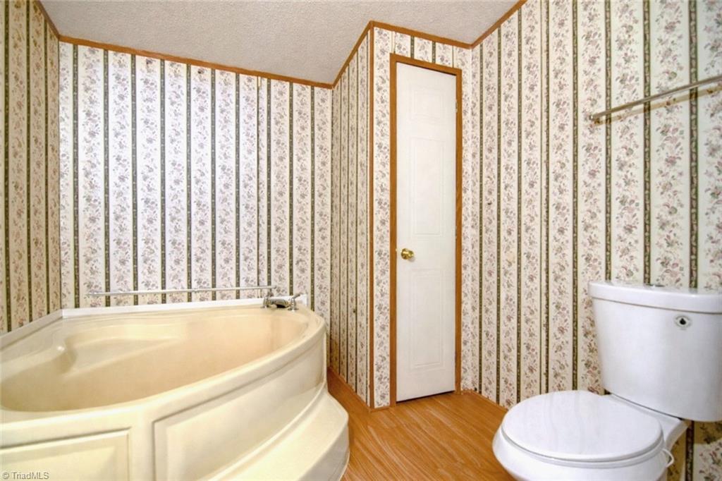 5600 Bunch Road Oak Ridge, NC 27310 - Photo 14 of 29 Primary Ensuite with deep soaking tub.