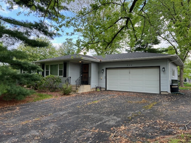 220 May Street Manhattan, IL 60442 - Photo 1 of 16 a front view of a house with a garden