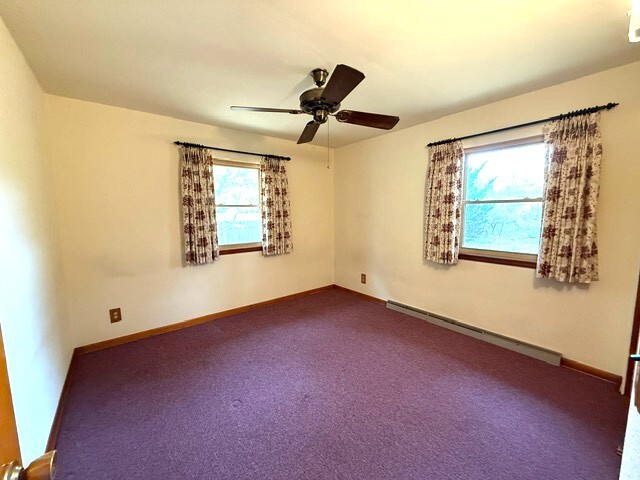 220 May Street Manhattan, IL 60442 - Photo 7 of 16 a view of an empty room with a window