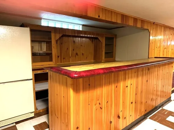 a view of a refrigerator in a kitchen