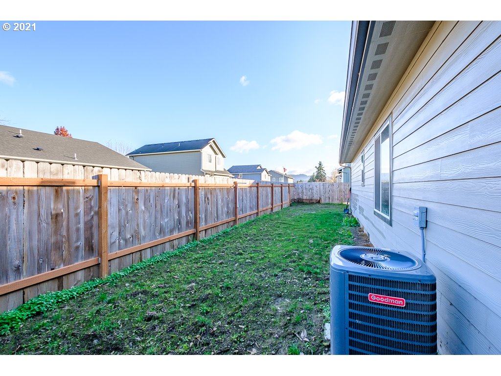 806 Wassom Street Lebanon, OR 97355 - Photo 27 of 30 a view of a backyard with wooden fence