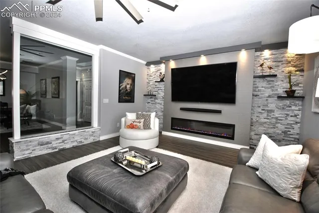 a living room with furniture and a flat screen tv