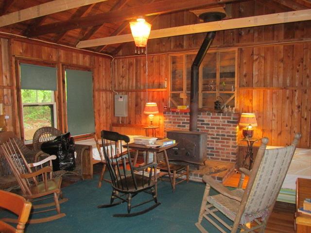 104 Pine Beach Road Belgrade, ME 04917 - Photo 9 of 21 living room with wood stove