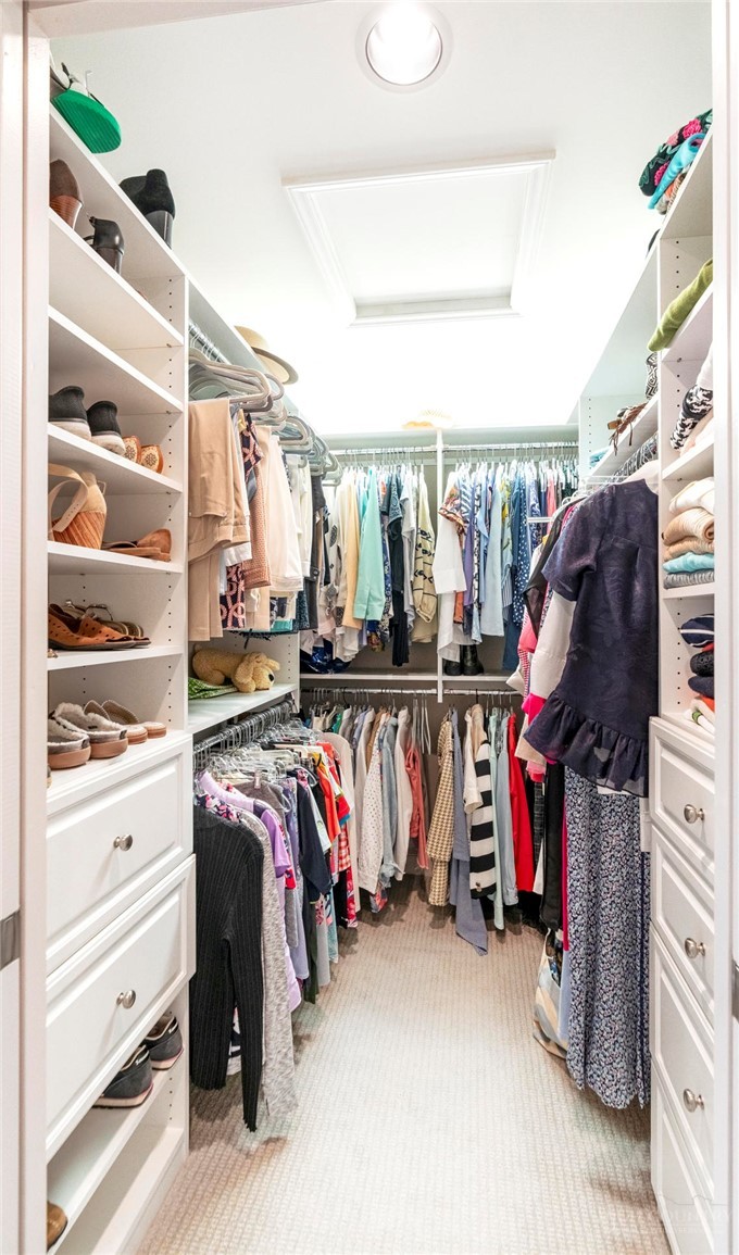361 The Lakes, Unit C9 Boone, NC 28607 - Photo 29 of 47 a view of walk in closet with clothes and shoes