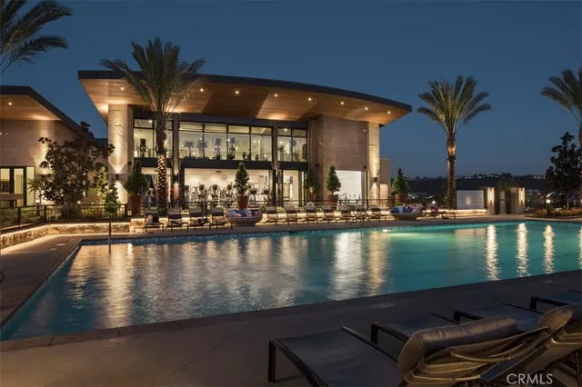 a view of a swimming pool with outdoor seating