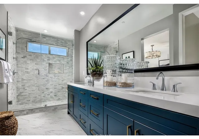 a bathroom with a double vanity sink mirror and double