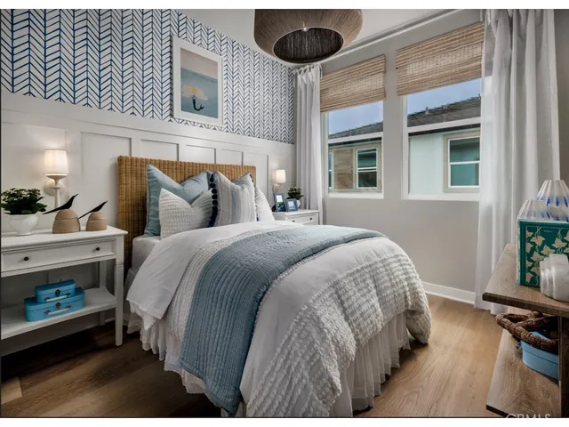 a bed room with a bed and a large window