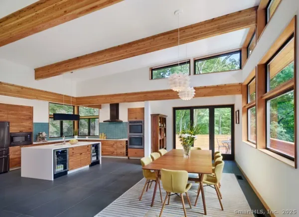 a dining room with a table and chairs