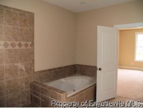 Lot 279 Falling Water Road Spring Lake, NC 28390 - Photo 11 of 12 a bathroom with a shower