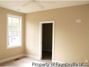 Lot 279 Falling Water Road Spring Lake, NC 28390 - Photo 5 of 12 a view of an empty room with a window