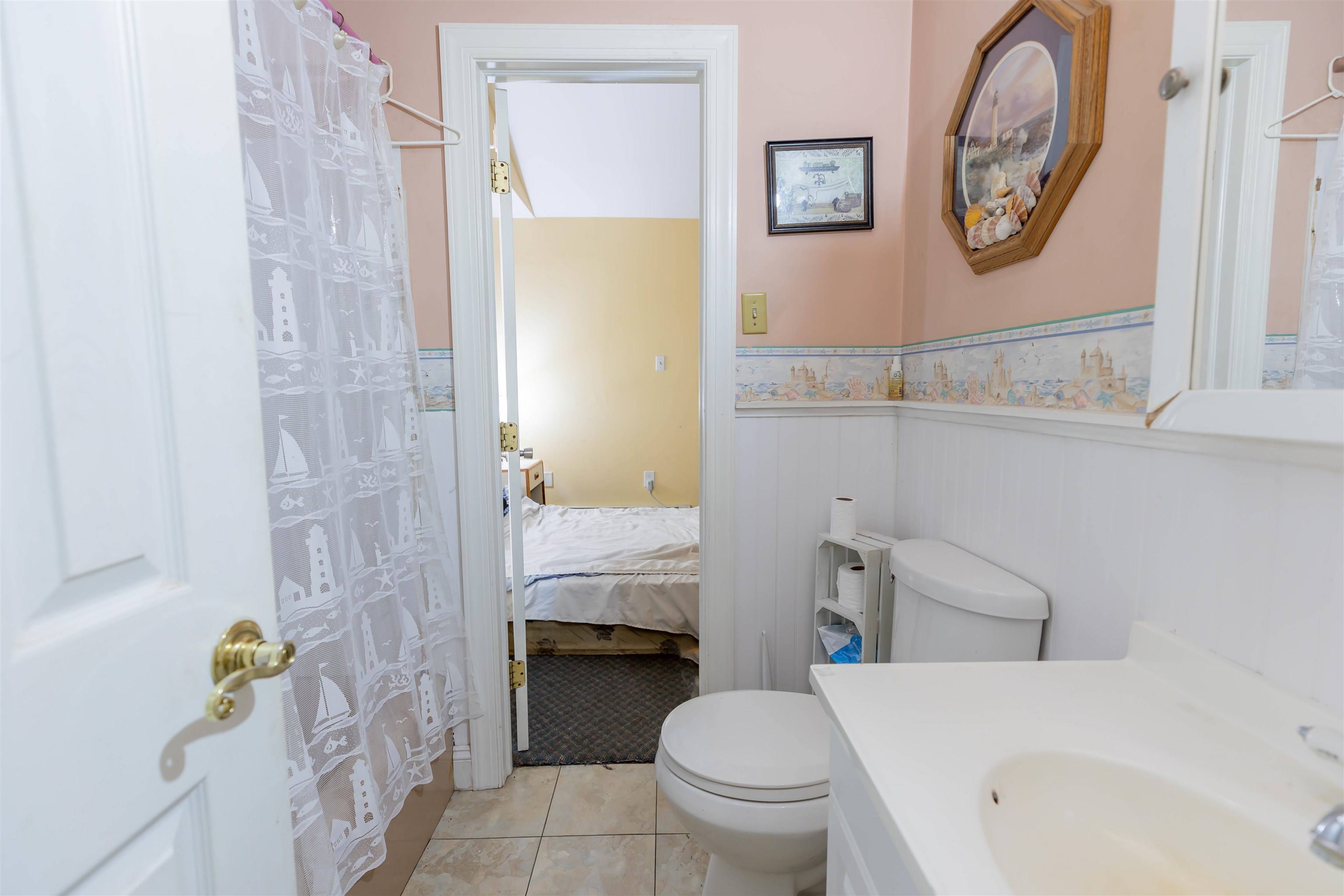 62 Bayshore Road Cape May Court House, NJ 08210 - Photo 15 of 32 a bathroom with a toilet and a shower curtain