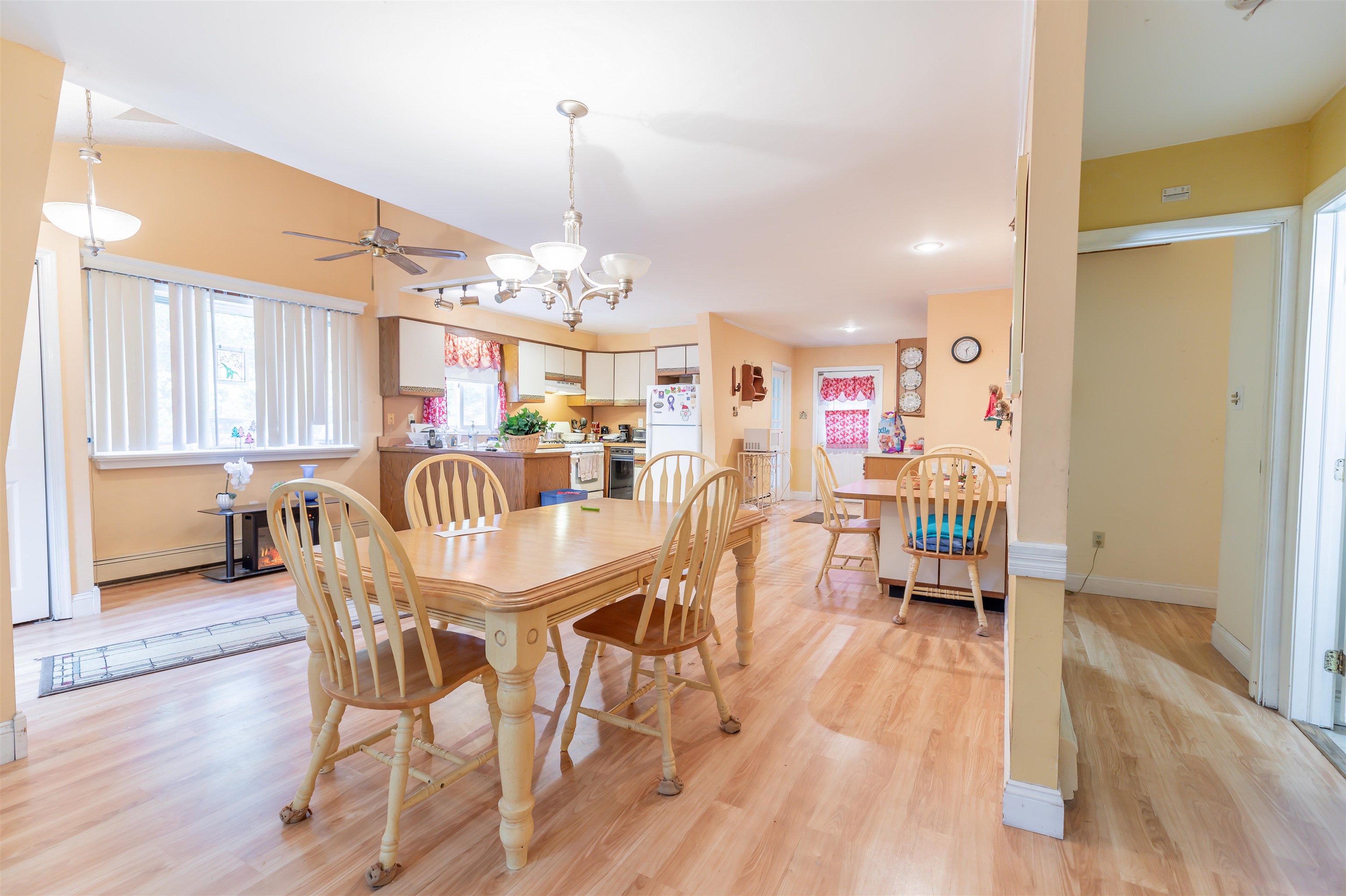 62 Bayshore Road Cape May Court House, NJ 08210 - Photo 4 of 32 a dining room with furniture a chandelier and wooden floor