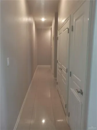 a bedroom with two beds and a window