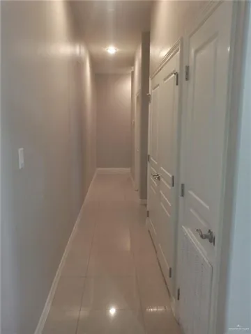 a bedroom with two beds and a window