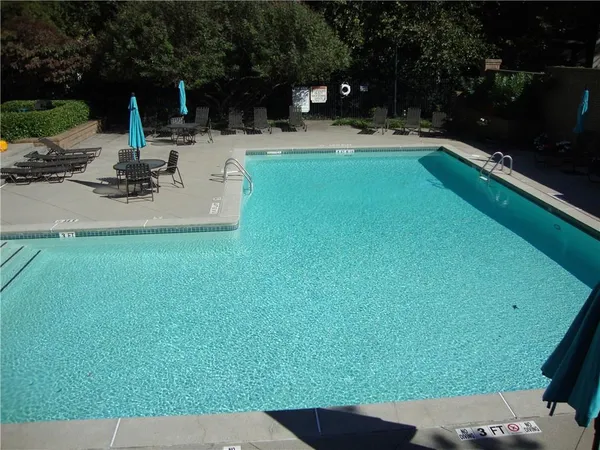 a view of a swimming pool with a patio