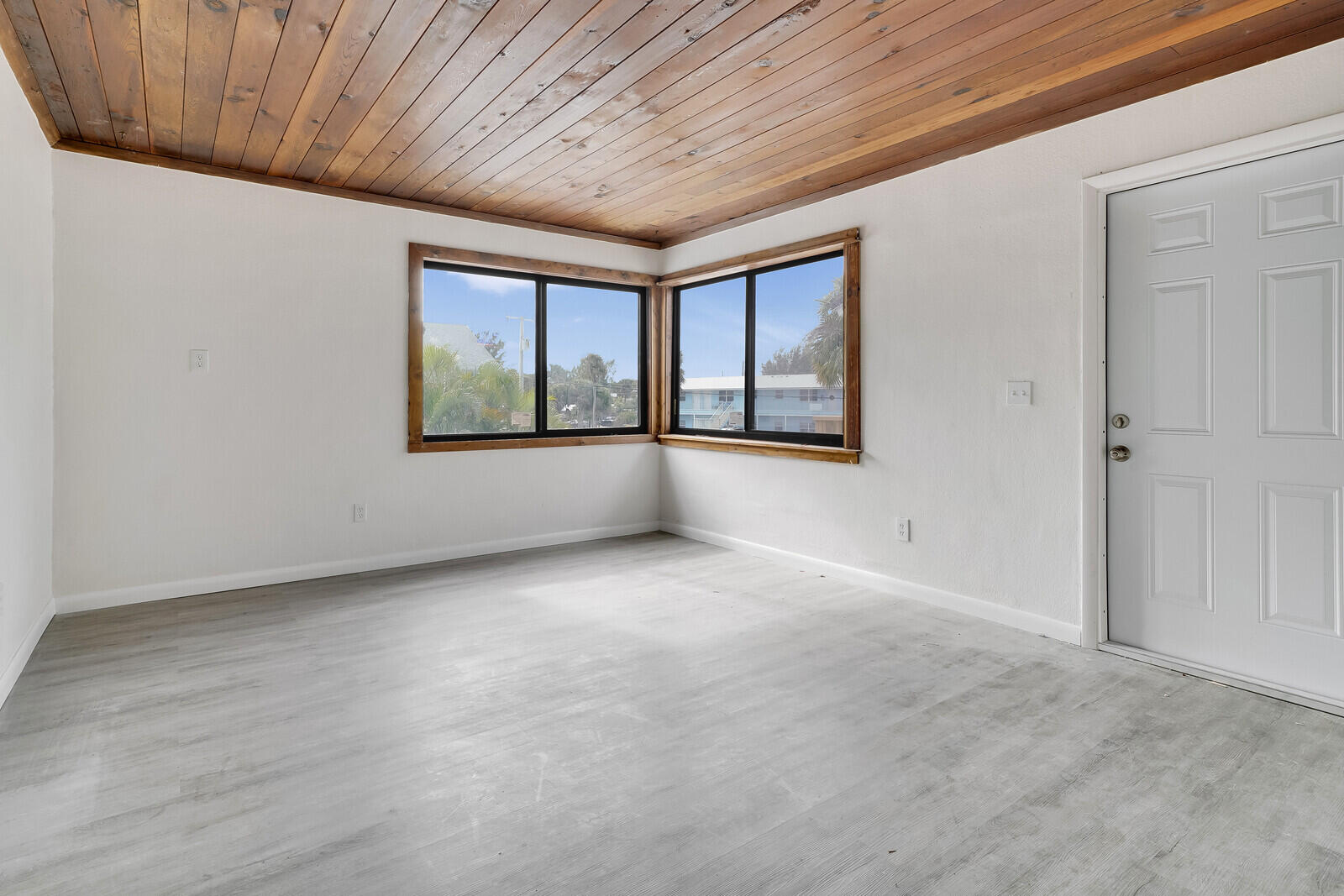 652 Hernando Street, Unit C Fort Pierce, FL 34949 - Photo 3 of 18 an empty room with windows