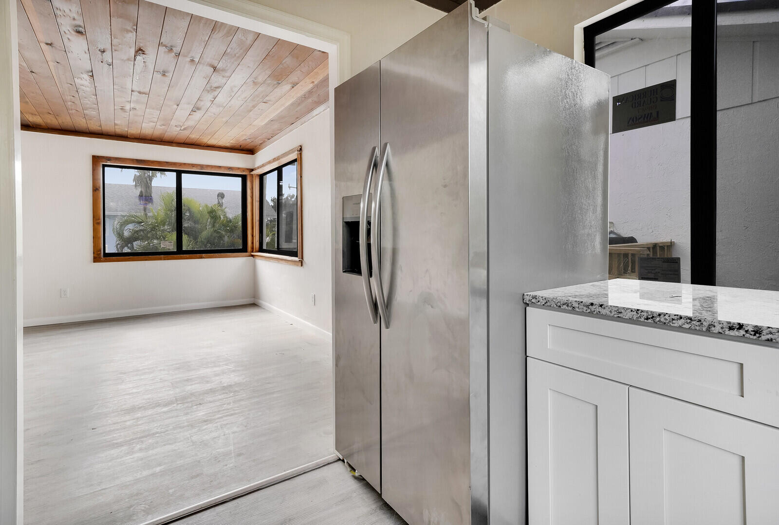 652 Hernando Street, Unit C Fort Pierce, FL 34949 - Photo 7 of 18 a bathroom with a granite countertop sink and shower