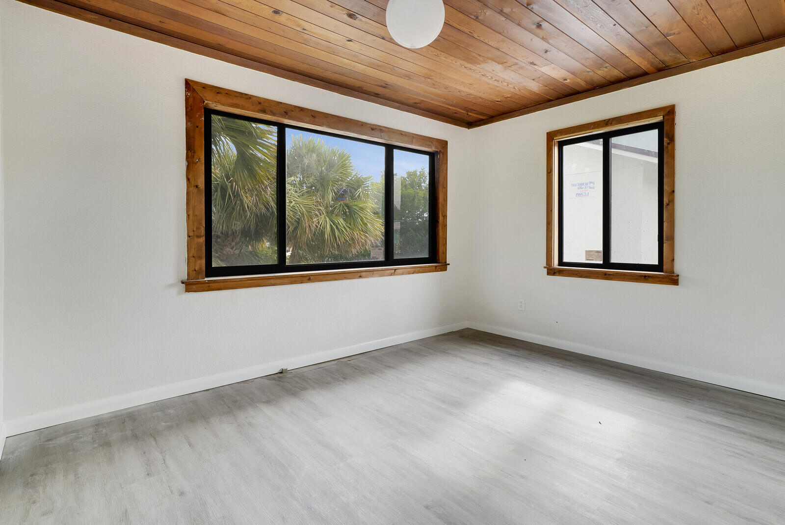 652 Hernando Street, Unit C Fort Pierce, FL 34949 - Photo 8 of 18 an empty room with windows