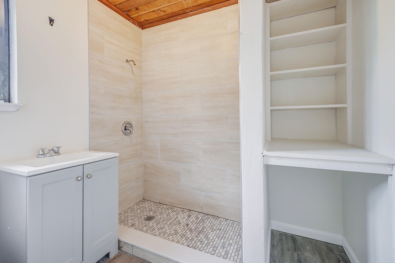 652 Hernando Street, Unit C Fort Pierce, FL 34949 - Photo 10 of 18 a bathroom with a sink a toilet and shower