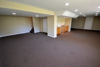766 Graham Road North Aurora, IL 60542 - Photo 14 of 21 an empty room with a kitchen space and a sink