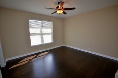 766 Graham Road North Aurora, IL 60542 - Photo 8 of 21 a view of empty room with wooden floor and fan