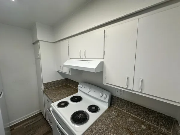 a kitchen with a sink and refrigerator