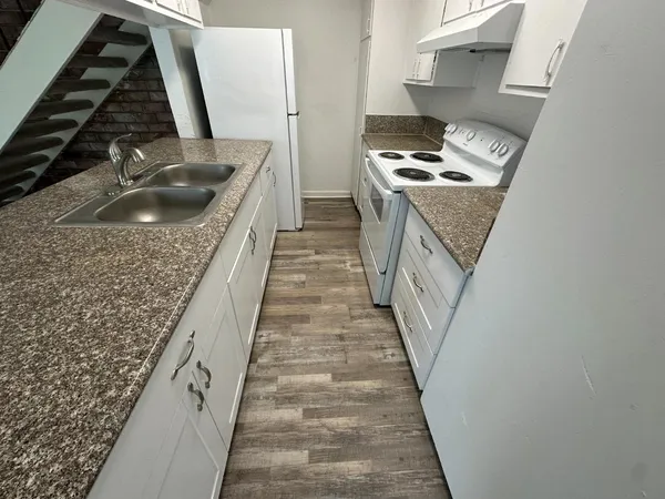 a bathroom with a sink a toilet and a bathtub