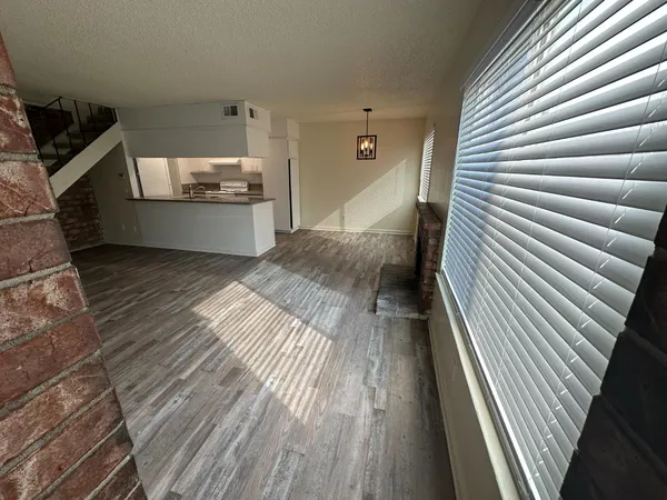 a view of kitchen and wooden floor