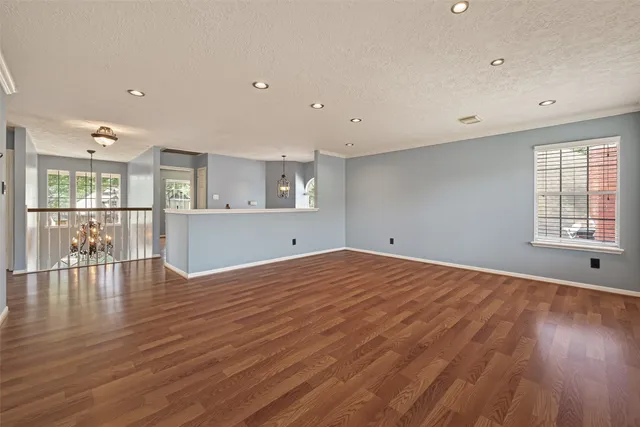 a view of room with wooden floor and window