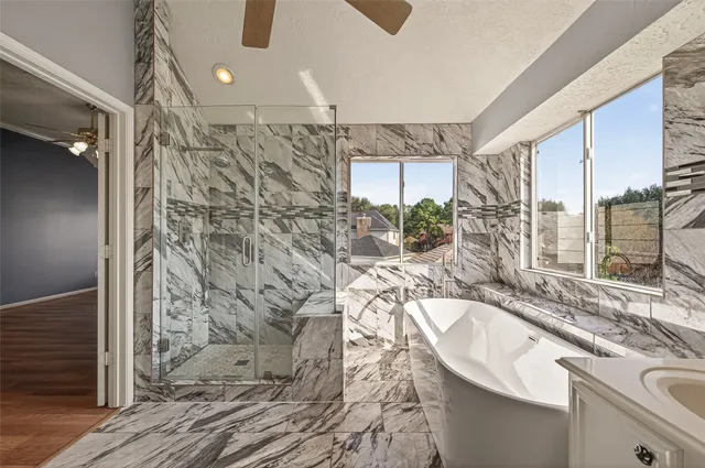 a bathroom with a bathtub and sink