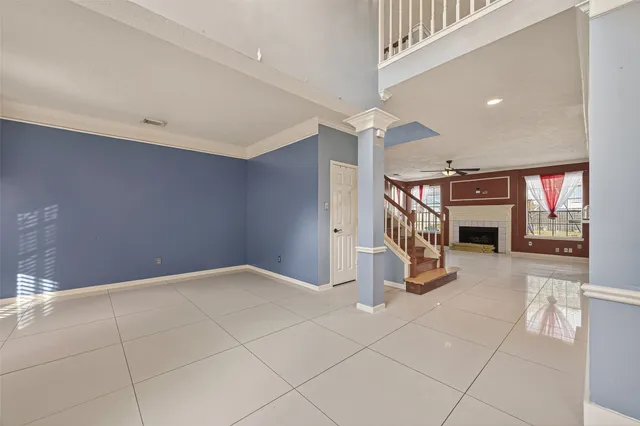 a view of a livingroom with stairs and a couch