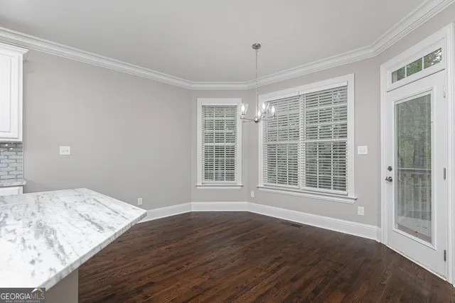 a kitchen with a sink stainless steel appliances and cabinets