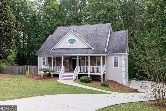a front view of a house with a yard and porch