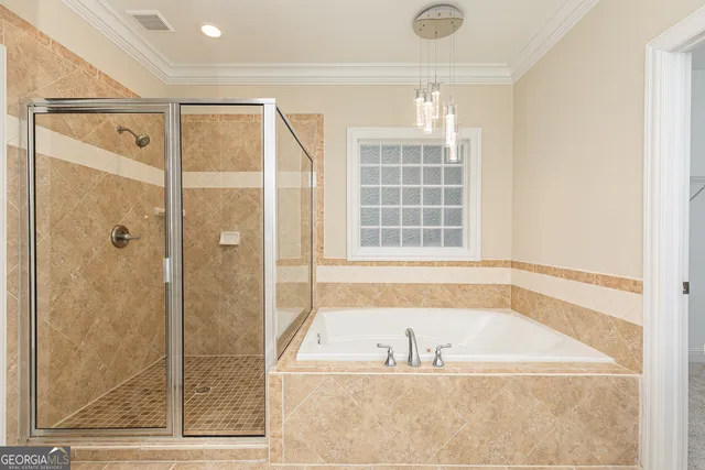a bathroom with a bathtub and a shower
