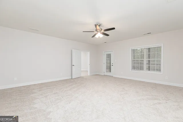 an empty room with entrance and empty room