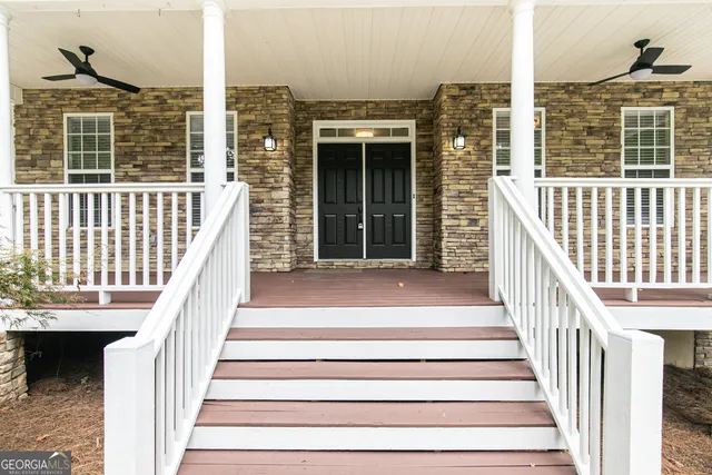 a view of a balcony with staircase