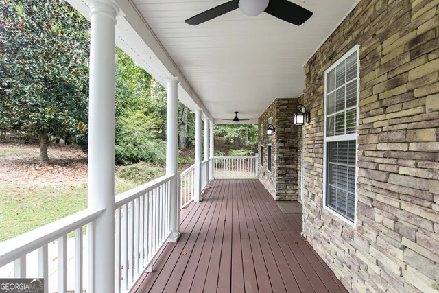 a view of a balcony with wooden floor