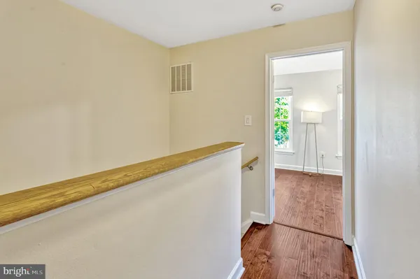 a view of entryway with wooden floor