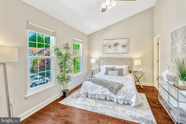 a bedroom with a large bed and a large window