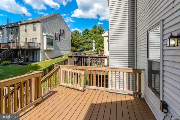 a view of a house with wooden deck