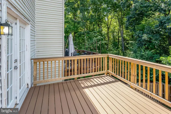 a view of balcony with wooden floor