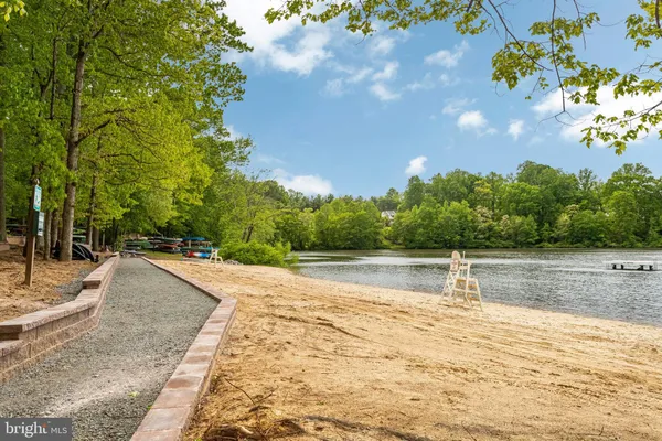 a view of a swimming pool with a yard
