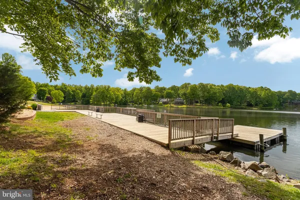 a view of a lake with sitting area