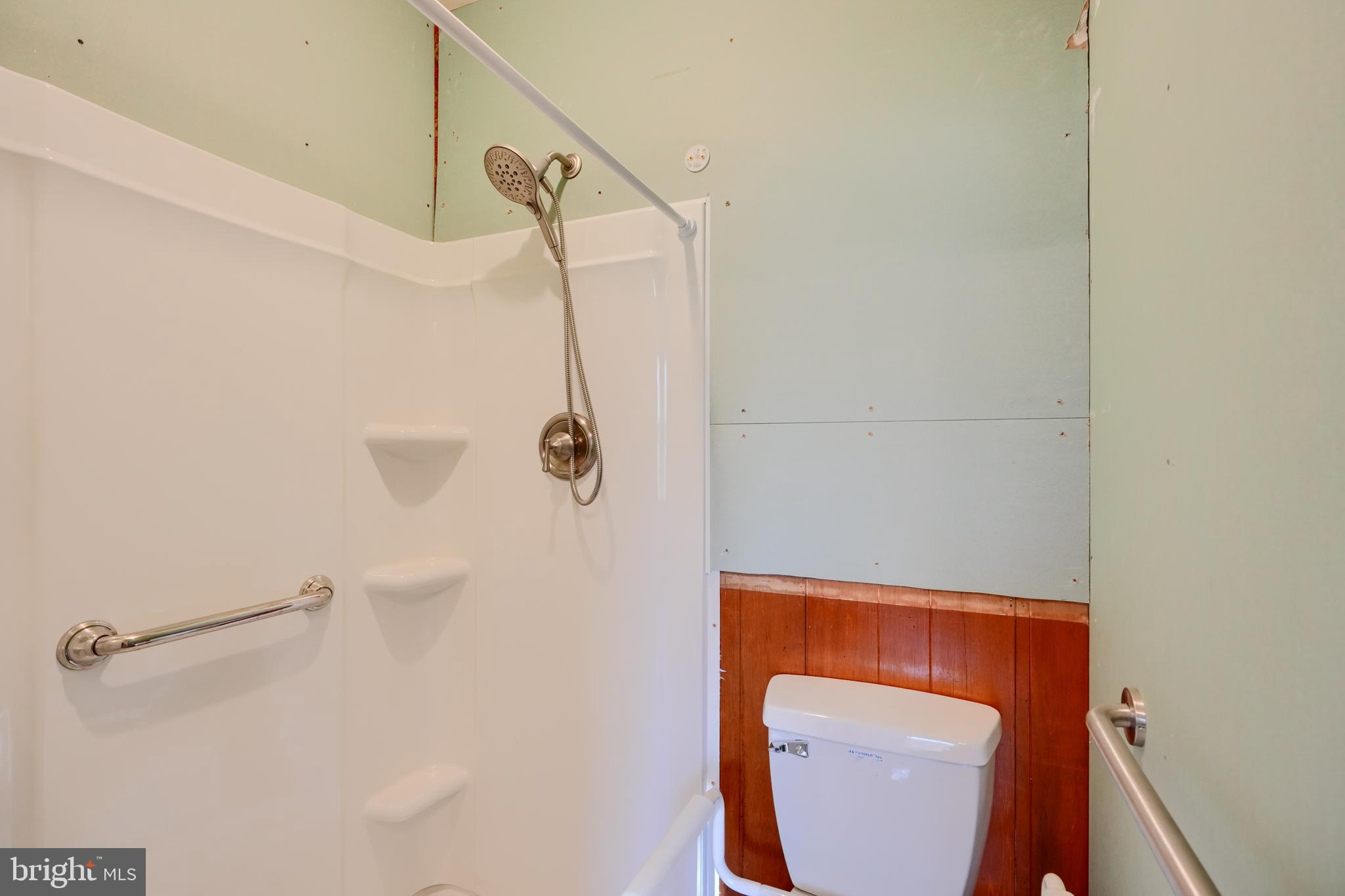 5312 Catalpha Road Baltimore, MD 21214 - Photo 11 of 37 a bathroom with a shower and toilet