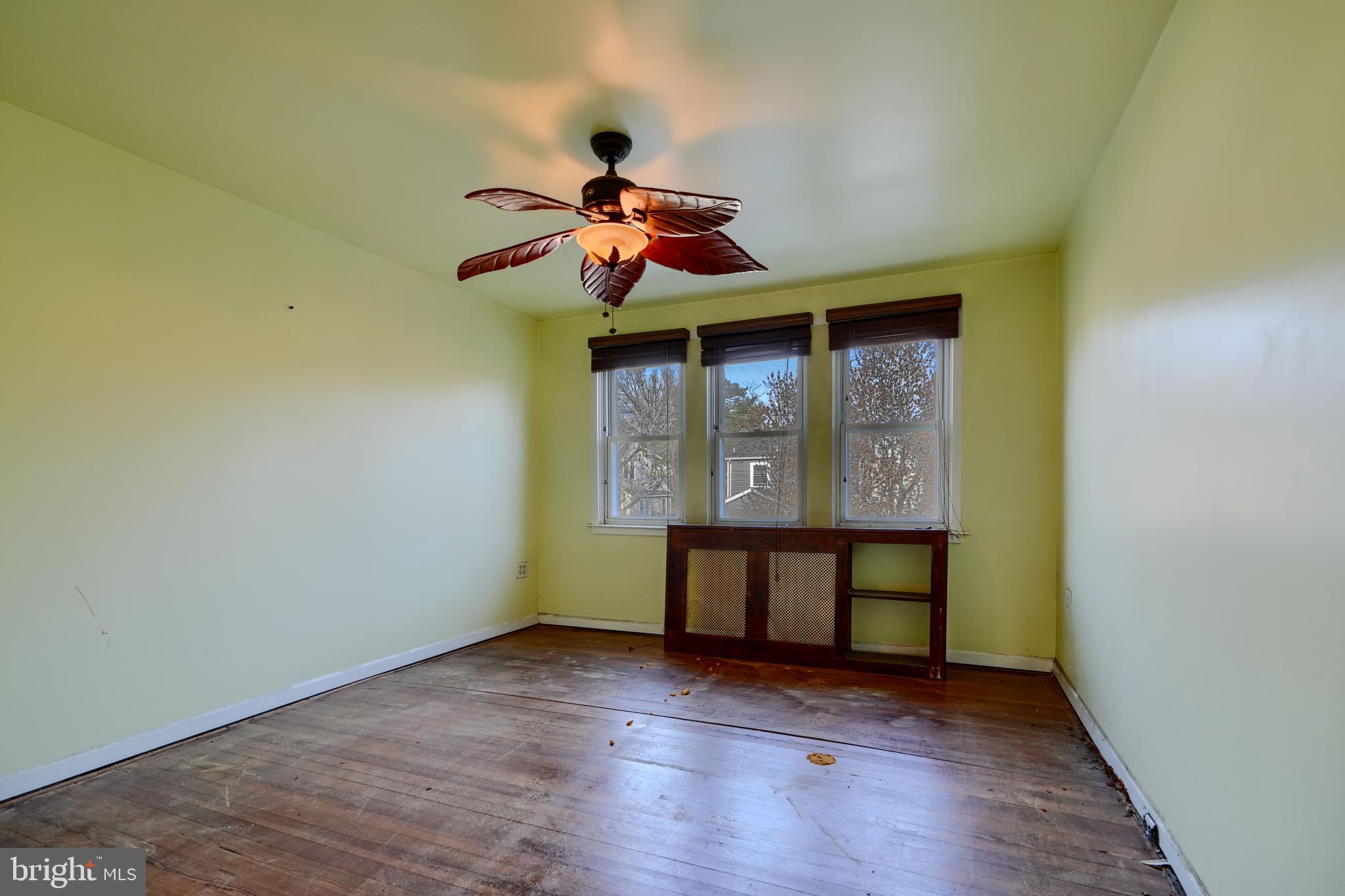 5312 Catalpha Road Baltimore, MD 21214 - Photo 18 of 37 wooden floor in an empty room with a window